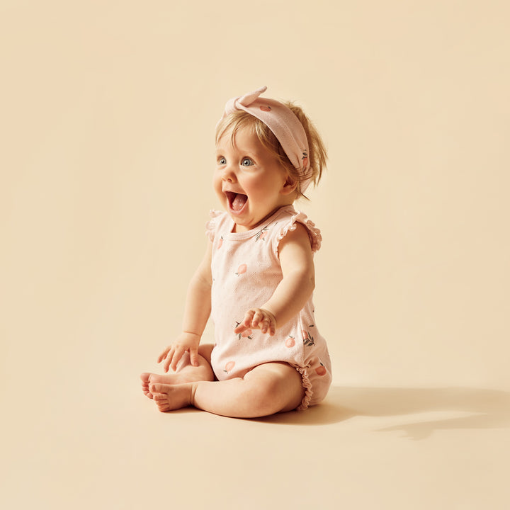 Wilson and Frenchy Peaches Organic Pointelle Ruffle Growsuit