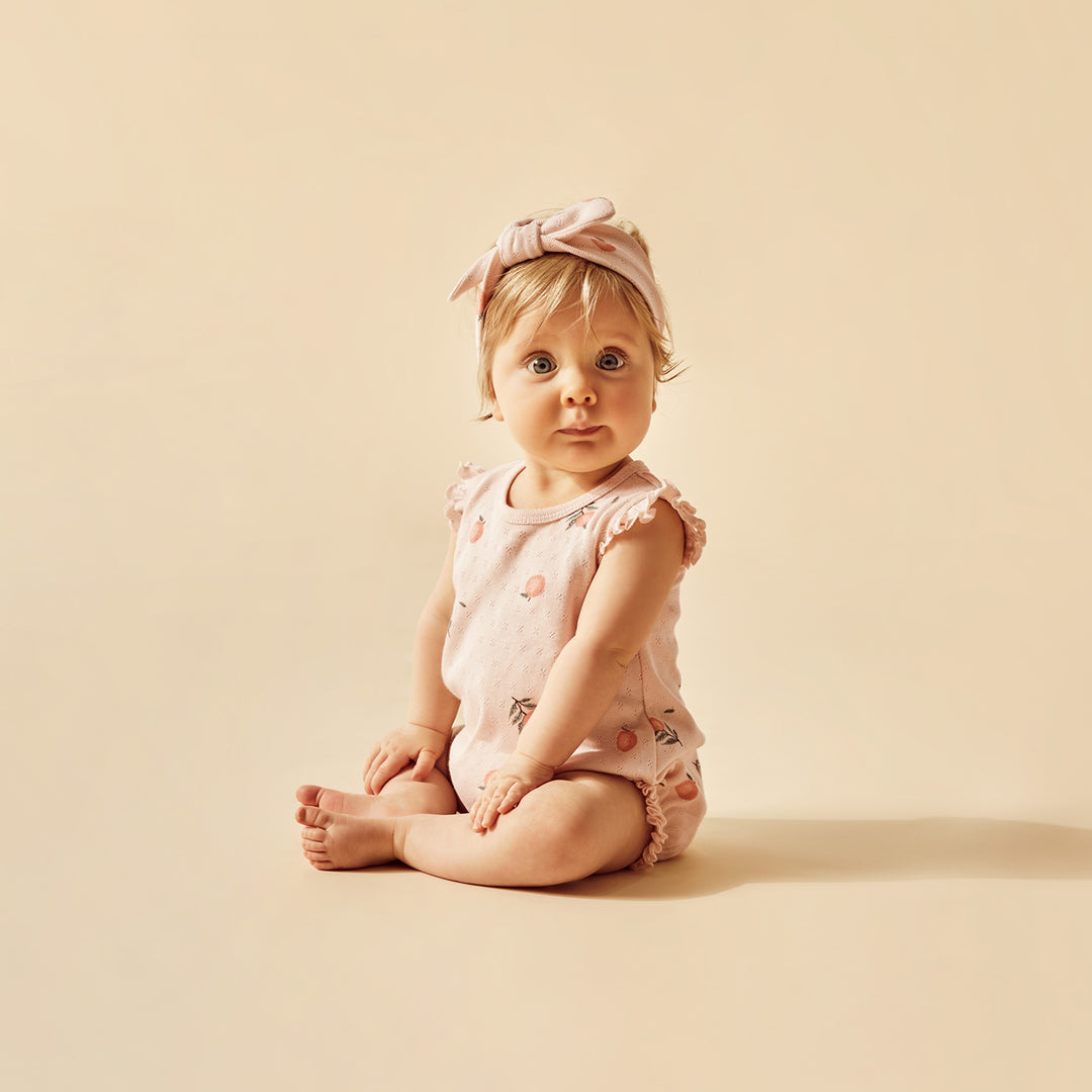 Wilson and Frenchy Peaches Organic Pointelle Ruffle Growsuit
