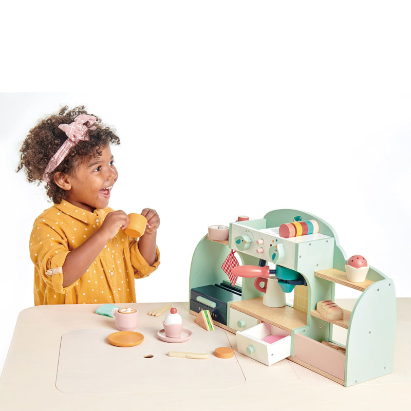 Emma pretend playing deals with toy cafe